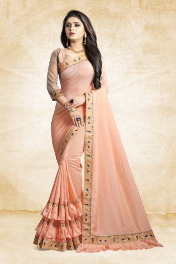 For A Pretty Designer Look, Grab This Deisgner Frill Saree In Peach Color Paired With Peach Colored Blouse. This Saree Is Fabricated On Vichitra Silk Paired With Art Silk Fabricated Blouse. It Has Very Pretty Frills And Border Giving The Saree An Attractive Look. 