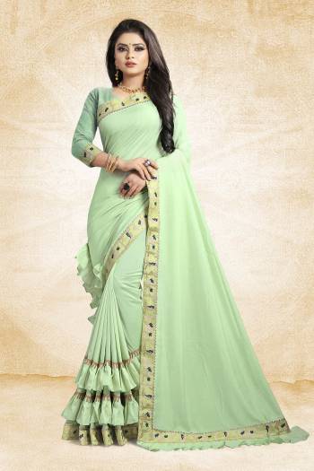 For A Pretty Designer Look, Grab This Deisgner Frill Saree In Pastel Green Color Paired With Pastel Green Colored Blouse. This Saree Is Fabricated On Vichitra Silk Paired With Art Silk Fabricated Blouse. It Has Very Pretty Frills And Border Giving The Saree An Attractive Look. 