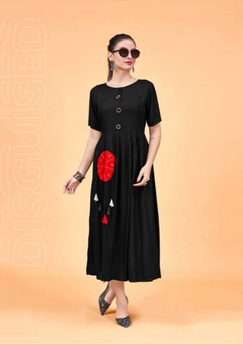 For A Bold And Beautiful Look, Grab This Designer Readymade Kurti In Black Color Fabricated On Rayon. Its Bold Black Color And Pretty Pattern Will Earn You Lots Of Compliments From Onlookers.