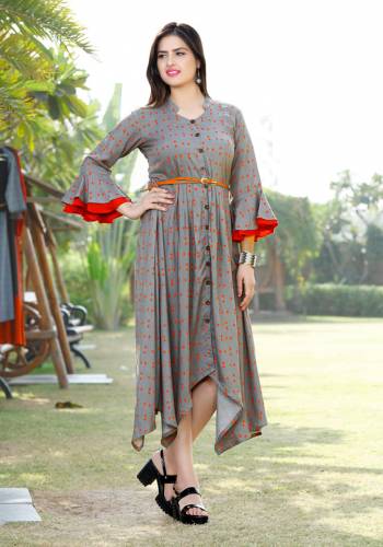 Here Is Another Readymade Kurti With High Low Pattern In Grey Color. This Kurti Is Fabricated On Rayon Beautified With Polka Dots Prints All Over It With Contrasting Red Color. 