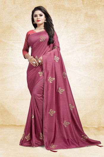 For A Bold And Beautiful Look This Festive Season, Grab This Designer Saree In Magenta Pink Color Paired With Dark Peach Colored Blouse. This Saree And Blouse Are Silk Based Beautified With Embroidered Butti All over The Saree. Buy This Saree Now.