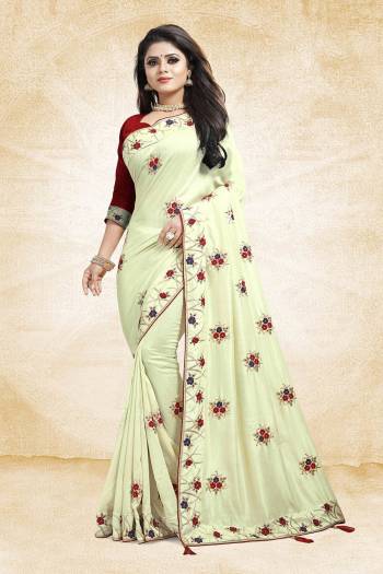 Look Beautiful And Earn Lots Of Compliments Wearing This Designer Saree In Pale Yellow Color Paired With Contrasting Maroon Colored Blouse. This Saree And Blouse Are Silk Based Beautified With Attractive Embroidery Which Gives An Elegant And Trendy Look To The Saree.