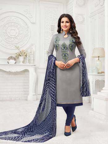 Flaunt Your Rich And Elegant Taste Wearing This Designer Suit In Grey Colored Top Paired With Navy Blue Colored Bottom And Grey And Navy Blue Colored Dupatta. Its Thread Embroidered Top Is Fabricated On Modal Silk Paired With Cotton Bottom And Chiffon Fabricated Dupatta. 