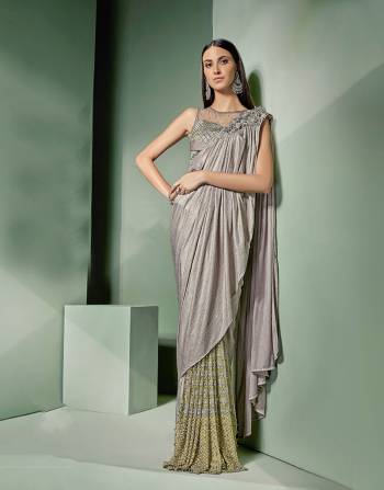 Embrace accentuated patterns and detail in this ready-to-wear saree with embellished skirt and look mesmerizing. Opt for a sleek hairdo for a maximal impact