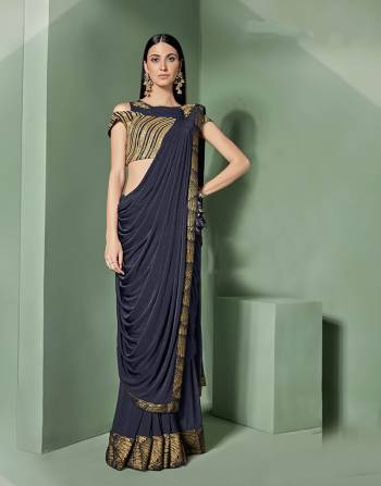 The joy of dressing comes true with this subtly gorgeous pre-draped saree and a designer blouse. Go for a glossy make-up to balance the look. 