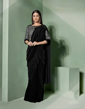 This saree is all about the key elements of this season- ruffles and drapes. With layers of frills on the pallu, this saree is feminine and at its stylish best. 