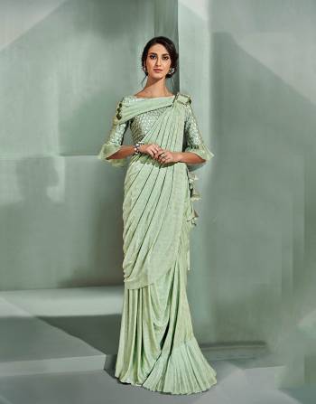 A pre-draped saree in refreshing sorbet shade, and tonal trims and details is everything you need to make your wedding presence memorable. 