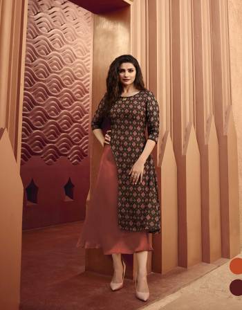 Rich Color Pallete Is Here With This Designer Readymade Kurti In Brown And Rust Color Fabricated On Art Silk And Satin .This Kurti Is Beautified With Prints And Stone Work. This Double Layered Kurti Has Pretty Asymetric Pattern. Buy Now.