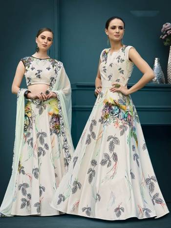 For A Girly Trendy Look, Grab This Designer Two In One Lehenga Choli Which You Can Also Make It As Gown. This Lehenga Choli Is Fabricated On Spandex Silk Paired With Chiffon Fabricated Dupatta. It Is Beautified With Bold Floral Prints And Stone Work. Its Fabric Has Strech Which Ensures Superb Comfort Throughtout The Gala. 