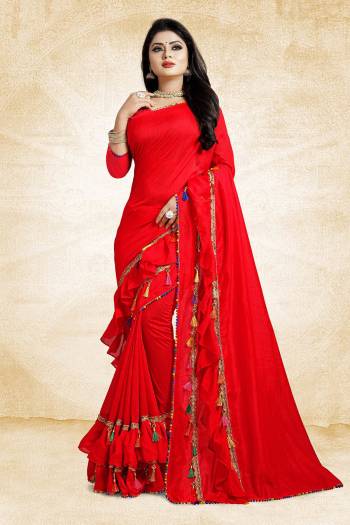 Catch All The Limelight At The Next Wedding You Attend With This Designer Saree In Red Color Paired With Red Colored Blouse. This Saree And Blouse are Silk Based Beautified With Fancy Laces And Frill Border. 