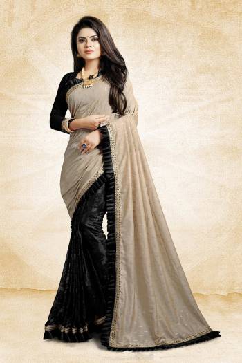 Here Is A Beautiful Designer Saree For The Next Party You Attend. Grab This Designer Saree In Grey And Black Color Paired With Black Colored Blouse, This Saree Is Fabricated On Linen And Fancy Fabric Paired With Art Silk Fabricated Blouse. It Has Pretty Fancy Work And Frill Lace Border. 