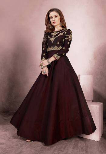 For A Royal Look, Grab This Designer Readymade Gown In Maroon Color Fabricated On Tafeta Silk. It Is Beautified With Attractive Embroidery Over The Yoke And Sleeves. 