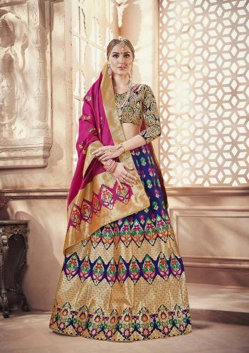 Celebrate This Festive Season with Beauty And Comfort Wearing this Designer Silk Based Lehenga Choli In Multi Colored Blouse Paired With Royal Blue Colored Lehenga And Dark Pink Colored Dupatta. It Is Beautified With Weave All Over.