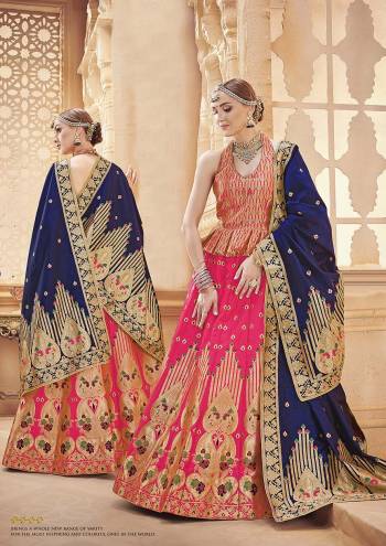 Shine Bright Wearing This Designer Silk Based Lehenga Choli In Dark Pink Color Paired With Contrasting Navy Blue Colored Dupatta. It Is Fabricated On Banarasi Art Silk Which Gives A Rich Look To Your Personality. 