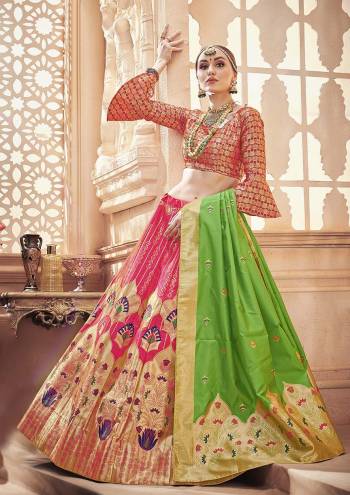 Shine Bright Wearing This Designer Silk Based Lehenga Choli In Dark Pink Color Paired With Contrasting Green Colored Dupatta. It Is Fabricated On Banarasi Art Silk Which Gives A Rich Look To Your Personality. 