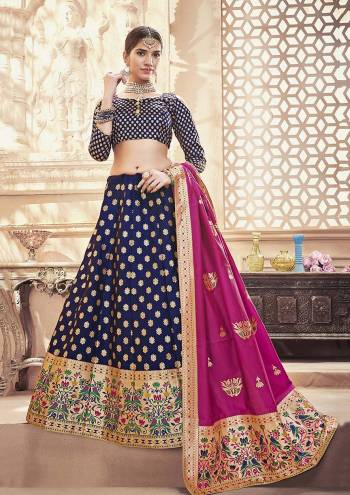 Enhance Your Personality Wearing This Designer Silk Based Lehenga Choli In Navy Blue Color Paired With Magenta Pink Colored Dupatta. This Lehenga Choli And Dupatta are Fabricated On Banarasi Art Silk Beautified With Weave All Over. Buy Now.