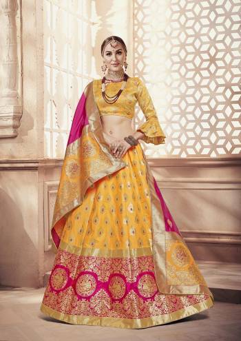 Catch All The Limelight At The Next Function You Attend With This Designer Lehenga Choli In Yellow Color Paired With Contrasting Dark Pink Colored Dupatta. This Whole Attire Is Fabricated On Banarasi Art Silk Beautified With Attractive Weave All Over. 