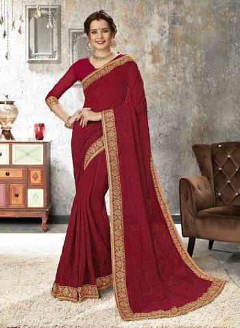 For A Royal And Elegant Look, Grab This Heavy Embroidered Saree In Maroon Color Paired With Maroon Colored Blouse. This Saree Is Chiffon Based Paired With Art Silk Fabricated Blouse. It Is Beautified With Heavy Tone To Tone Embroidery And Lace Border. 