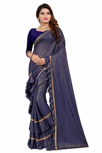 Get Ready For The Upcoming Party At Your place With This Designer Saree In Navy Blue Color Paired With Navy Blue Colored Blouse. This Saree Is Fabricated On Lycra Paired With Art Silk Fabricated Blouse. It Has Pretty Two Layer Frill With Lace Border. Buy This Designer Piece Now. 