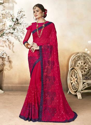 Shine Bright In This Designer Dark Pink Colored Saree Paired With Dark Pink Colored Blouse. This Saree Is Fabricated On Georgette Paired With Art Silk Fabricated Blouse. It Is Beautified with Heavy Resham Embroidery And Stone Work. 