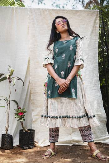 Follow This Amazing Trend Of Designer Readymade Pair Of Kurti And Pants. Its Both Top And Bottom Are Fabricated On Khadi Beautified With Prints And Thread Embroidery. It Is Light In Weight And Easy To Carry All Day Long. Buy Now.