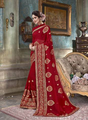 A Must Have Shade In Every Womens Wardrobe Is Here With This Designer Saree In Red Color Paired With Red Colored Blouse. This Saree And Blouse Are Fabricated On Georgette Beautified With Jari And Thread Embroidery With Stone Work. 