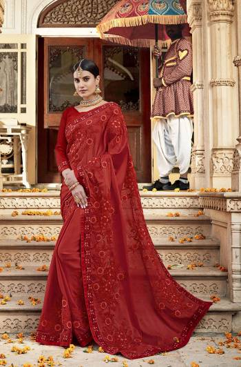 Adorn The Pretty Angelic Look In This Designer Red Colored Saree Paired With Red Colored Blouse. This Pretty Embroidered Saree In Satin Georgette Based Paired With Art Silk Fabricated Blouse. 