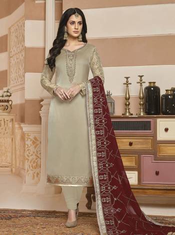 Simple and Elegant Looking Designer Straight Suit Is Here In Rich Cream Color Paired With Maroon Colored Dupatta., Its Top Is Fabricated On Satin Georgette Paired With Santoon Bottom And Georgette Fabricated Dupatta. 