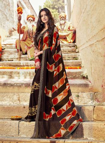 Enhance Your Personality In This Light Weight And Comfortable Georgette Based Saree In Brown Color Paired With Brown Colored Blouse. It Is Beautified With Prints And Lace Border. Buy Now.