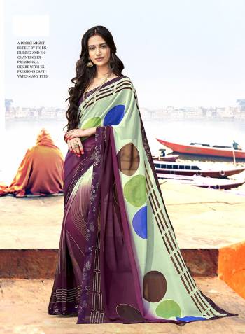 Flaunt Your Rich And Elegant Taste Wearing This Pretty Saree In Pastel Green And Wine Color Paired With Wine Colored Blouse. This Saree Is Fabricated On Georgette Paired With Art Silk Fabricated Blouse.  It Is Light In Weight And Easy To Carry All Day Long. 