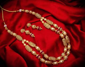 New And Unique Patterned Designer Necklace Set Is Here In Golden Color With Double Layer. It Is Beautified With Pearl Work And Also Light In Weight And Can Be Paired With Any Colored Ethnic Attire.