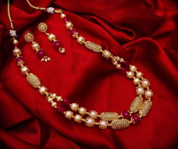 New And Unique Patterned Designer Necklace Set Is Here In Golden Color With Double Layer. It Is Beautified With Pearl Work And Also Light In Weight And Can Be Paired With Any Colored Ethnic Attire.