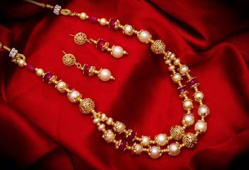 New And Unique Patterned Designer Necklace Set Is Here In Golden Color With Double Layer. It Is Beautified With Pearl Work And Also Light In Weight And Can Be Paired With Any Colored Ethnic Attire.