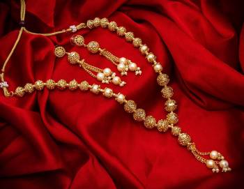 New And Unique Patterned Designer Necklace Set Is Here In Golden Color With Double Layer. It Is Beautified With Pearl Work And Also Light In Weight And Can Be Paired With Any Colored Ethnic Attire.