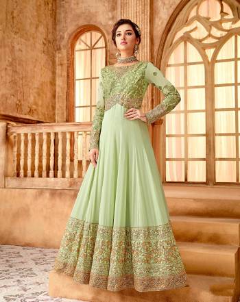 Simple and Elegant Looking Designer Floor Length Suit Is Here In Pastel Green Color. Its Top Is Fabricated On Georgette Beautified With Heavy Embroidered Yoke And Suit Panel Paired With Santoon Bottom And Chiffon Fabricated Dupatta. 