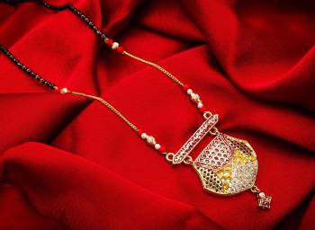 Rich And Elegant Looking Designer Mangalsutra Is Here In Golden Color. It Is Beautified With Stone Work And Also Light Weight Which Is Easy To Carry All Day Long. 