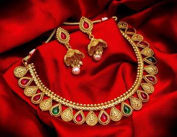 Grab This Heavy Necklace Set For The Upcoming Wedding Season. Pair This Up With Your Heavy Ethnic Attire And As It Is In Golden Color, It Can Be Paired With Any Colored Attire. Buy Now