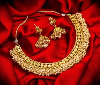 Grab This Heavy Necklace Set For The Upcoming Wedding Season. Pair This Up With Your Heavy Ethnic Attire And As It Is In Golden Color, It Can Be Paired With Any Colored Attire. Buy Now