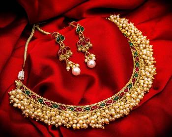 Grab This Heavy Necklace Set For The Upcoming Wedding Season. Pair This Up With Your Heavy Ethnic Attire And As It Is In Golden Color, It Can Be Paired With Any Colored Attire. Buy Now