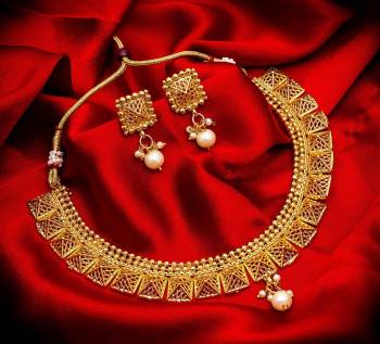 Grab This Heavy Necklace Set For The Upcoming Wedding Season. Pair This Up With Your Heavy Ethnic Attire And As It Is In Golden Color, It Can Be Paired With Any Colored Attire. Buy Now