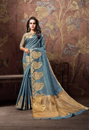 Flaunt Your Rich And Elegant Taste Wearing This Designer Silk Based Saree In Steel Blue Color. This Saree And Blouse Are Fabricated On Cotton Silk Beautified With Bold Motif Weave Over The Border. 