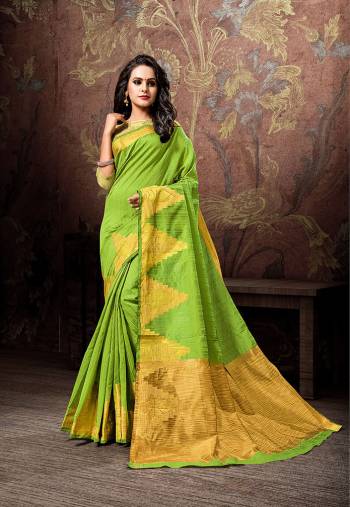 Look Pretty In This Designer Silk Based Saree In Green Color Paired With Gold And Green Colored Blouse.This Saee And Blouse Are Cotton Silk Based Beautified With Bold Weave Motifs. Buy This Saree Now.