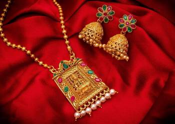 Give An Enhanced Look To Your Personality By Pairing Up This Beautiful Pendant Set With Your Ethnic Attire. This Pretty Set Is In Golden Color Beautified With Multi Colored Stone And Pearl Work. Buy Now.