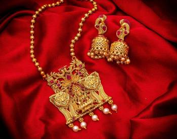 Give An Enhanced Look To Your Personality By Pairing Up This Beautiful Pendant Set With Your Ethnic Attire. This Pretty Set Is In Golden Color Beautified With Multi Colored Stone And Pearl Work. Buy Now.