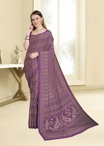 Add Some Casuals With This Pretty Printed Saree In Purple Color Paired With Purple Colored Blouse. This Saree And Blouse Are Fabricated On Crepe Beautified With Intricate Prints All Over It. 