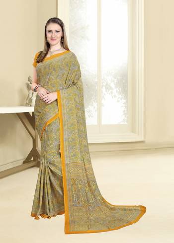 This Festive Season Look Pretty And Feel Comfortable Wearing This Designer Saree In Green And Yellow Color Paired With Musturd Yellow Colored Blouse. This Saree And Blouse Are Fabricated On Crepe Beautified With Intricate Prints All Over It. 