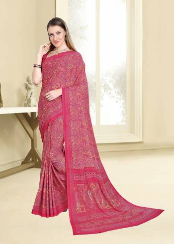 Add Some Casuals With This Pretty Printed Saree In Dark Pink Color Paired With Dark Pink Colored Blouse. This Saree And Blouse Are Fabricated On Crepe Beautified With Intricate Prints All Over It. 