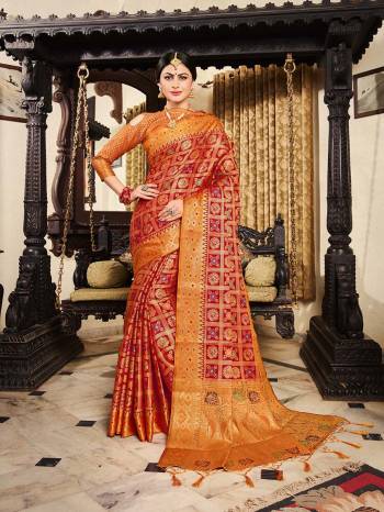 Here A Proper Traditional Color Pallete With This Designer Saree In Red Color Paired With Contrasting Orange Colored Blouse. This Saree And Blouse Are Fabricated On Lichi Art Silk Beautified With Weave All Over. Buy Now.