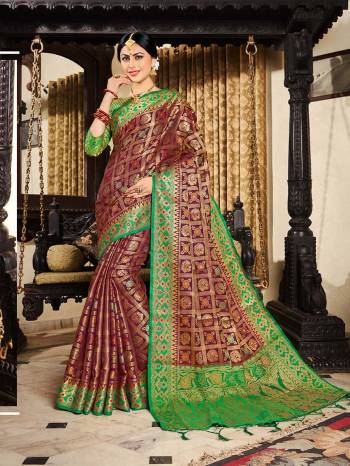 New Shade Is Here To Add Into Your Wardrobe With This Designer Saree In Wine Color Paired With Contrasting Green Colored Blouse, This Saree And Blouse are Fabricated On Lichi Art Silk Beautified With Heavy Weave.