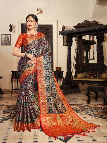 Enhance Your Personality Wearing This Heavy Weaved Designer Saree In Navy Blue Color Paired With Contrasting Orange Colored Blouse. This Saree And Blouse Are Fabricated On Lichi Art Silk. Buy Now.